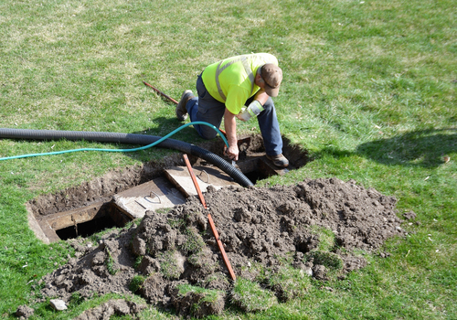 A,Worker,Doing,Routine,Maintenance,Pumping,Out,A,Home,Septic
